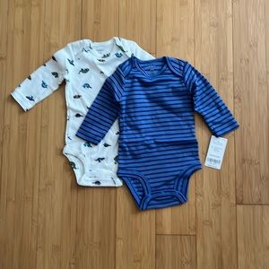 Set of two Carter’s 3 month long sleeved onesies.